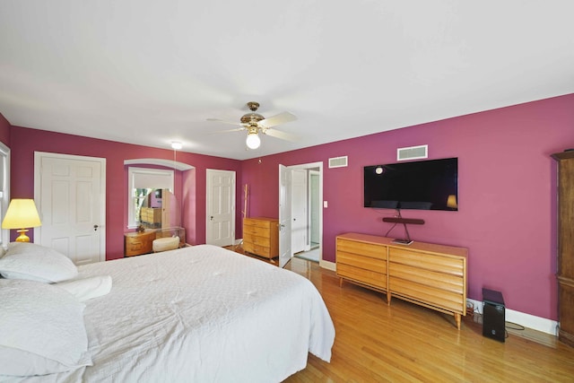 bedroom with hardwood / wood-style flooring and ceiling fan