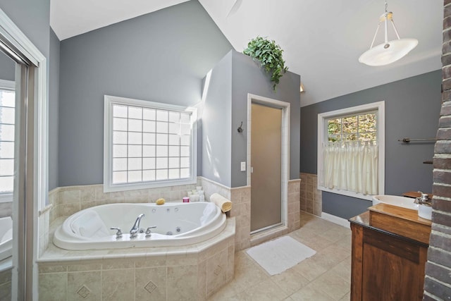 bathroom featuring separate shower and tub, tile patterned flooring, vanity, and lofted ceiling