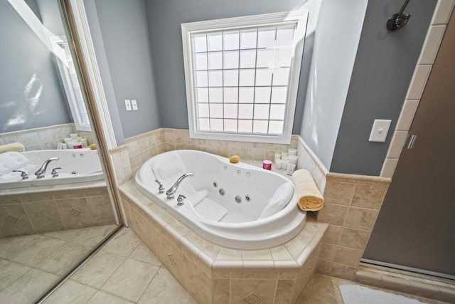 bathroom featuring tile patterned flooring and separate shower and tub