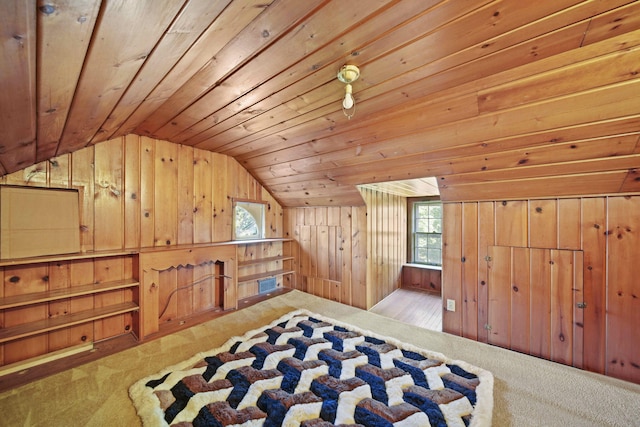 additional living space featuring light carpet, wooden walls, wood ceiling, and vaulted ceiling