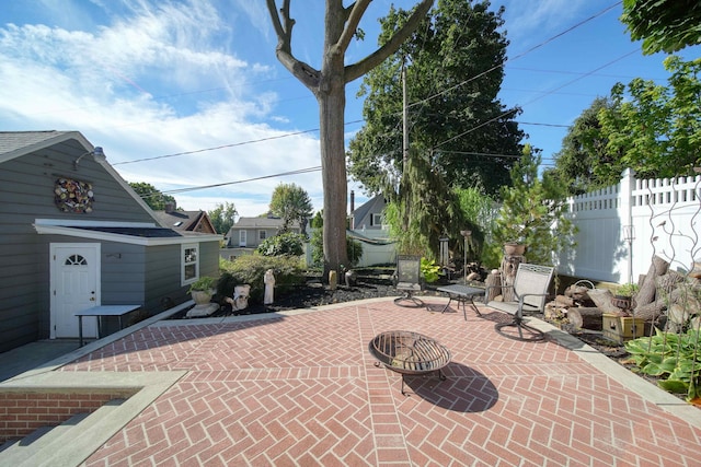 view of patio / terrace with an outdoor fire pit