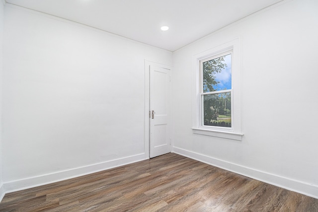 unfurnished room featuring dark hardwood / wood-style floors