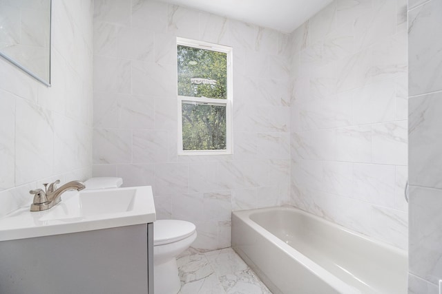 bathroom featuring vanity, toilet, and tile walls