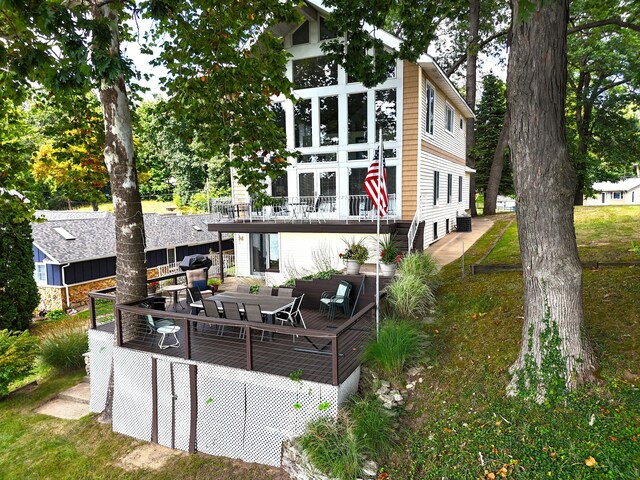 93810 Lake Ct, Dowagiac, MI 49047 - back of property featuring outdoor dining area, a wooden deck, and a balcony