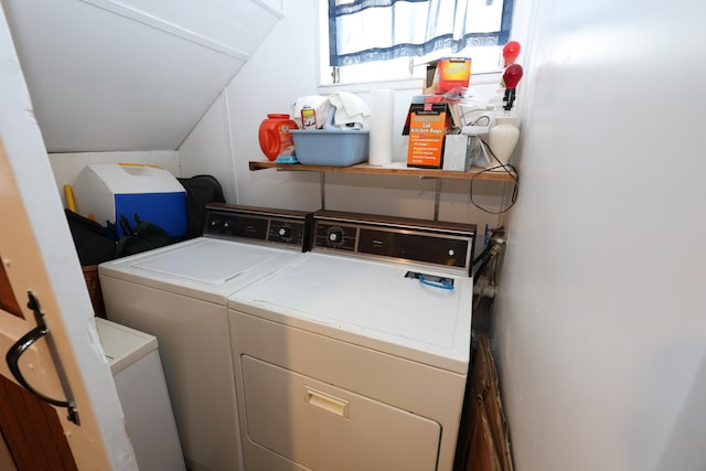 washroom with washing machine and clothes dryer