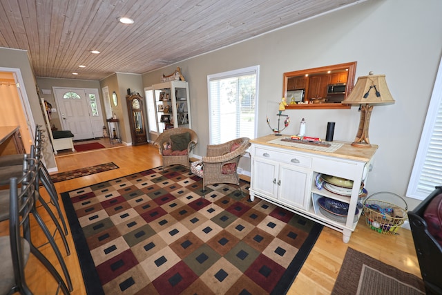 interior space with light hardwood / wood-style flooring and wood ceiling