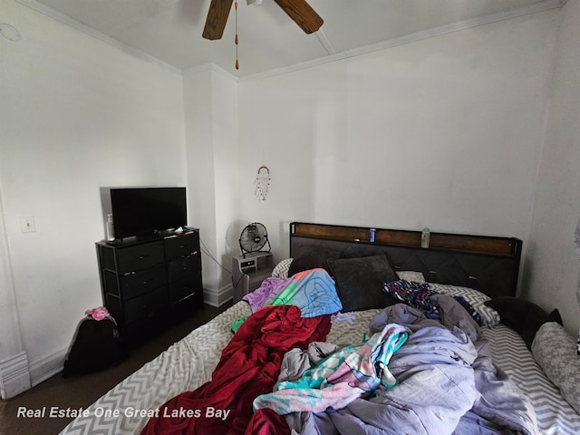 bedroom with ceiling fan and ornamental molding