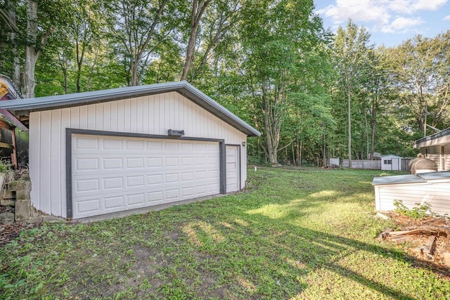 garage with a yard