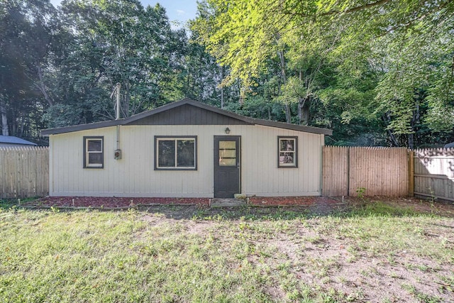 view of outbuilding featuring a yard