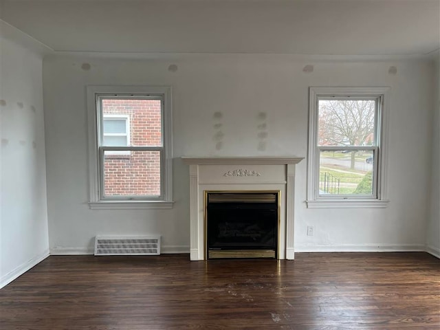 unfurnished living room featuring dark hardwood / wood-style flooring