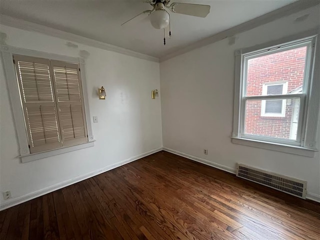 unfurnished room featuring ceiling fan, ornamental molding, and dark hardwood / wood-style flooring