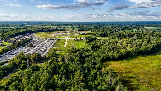 22440 23 Mile Rd, Macomb, MI 48042 - aerial view of property and surrounding area with a heavily wooded area