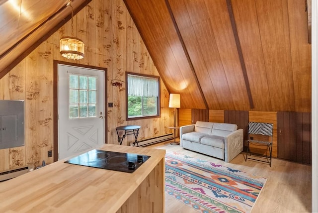 living area with wood ceiling, a baseboard heating unit, hardwood / wood-style flooring, electric panel, and wood walls