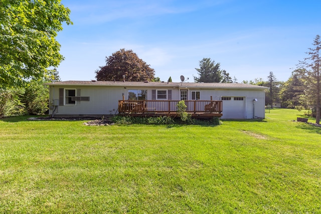 rear view of property with a wooden deck and a yard