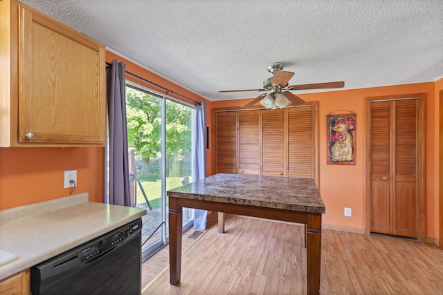 interior space featuring ceiling fan, a textured ceiling, and light wood-type flooring