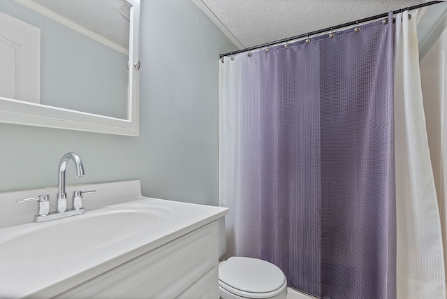 bathroom with vanity, a textured ceiling, and toilet