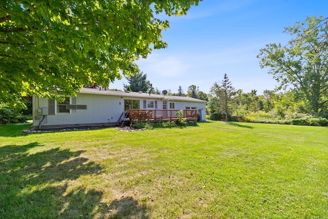 view of yard with a deck