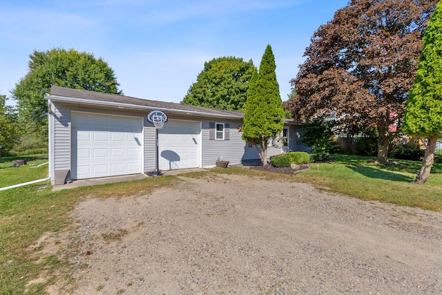 single story home with a garage and a front yard