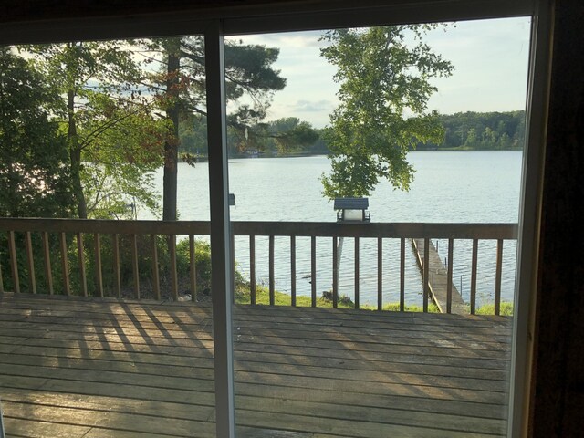 589 E Sidney Rd, Stanton, MI 48888 - wooden terrace with a water view