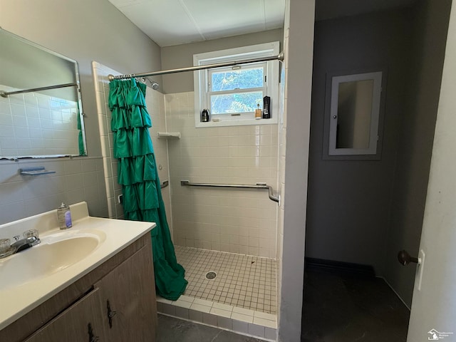 bathroom featuring tile patterned flooring, vanity, and a shower with shower curtain