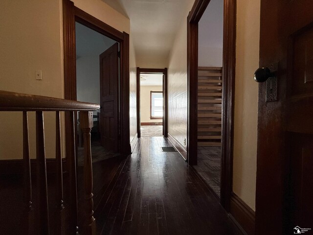 corridor featuring dark hardwood / wood-style flooring