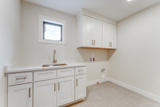 clothes washing area featuring washer hookup, hookup for an electric dryer, cabinets, and sink