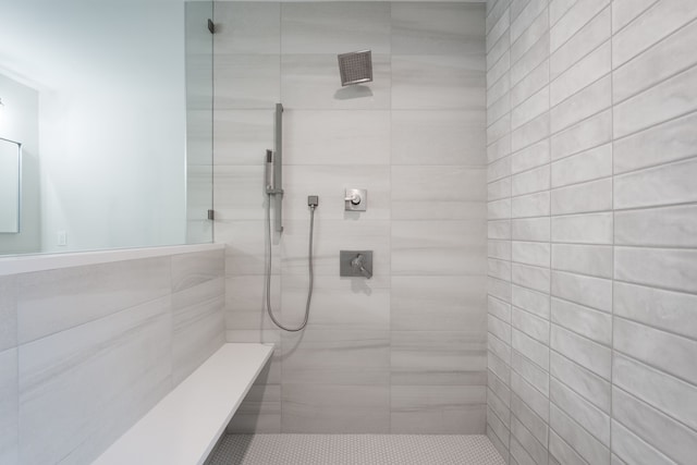 bathroom with tiled shower