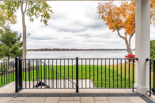 view of patio with a water view