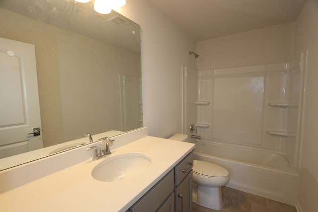 full bathroom featuring tile patterned floors, vanity, toilet, and tub / shower combination