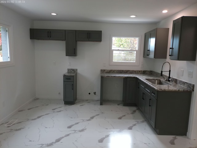 kitchen featuring gray cabinetry and sink