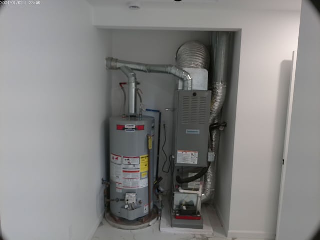 utility room with gas water heater