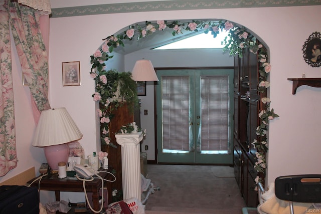 entryway with carpet flooring and french doors