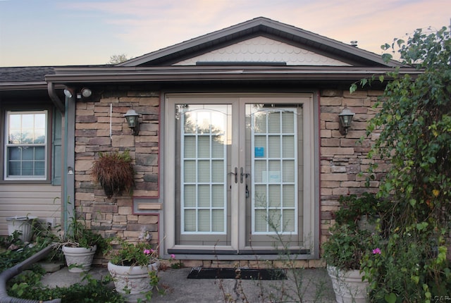 view of exterior entry at dusk