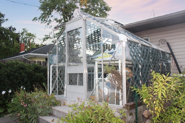 view of outdoor structure at dusk