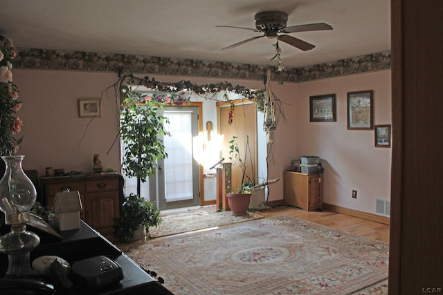 entrance foyer featuring ceiling fan and light hardwood / wood-style floors