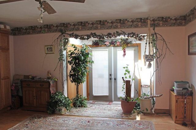 entrance foyer with french doors, light hardwood / wood-style flooring, and ceiling fan