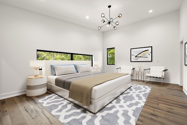 bedroom with a chandelier, dark wood-type flooring, baseboards, and recessed lighting