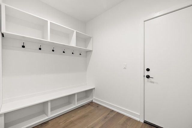 mudroom featuring wood finished floors and baseboards