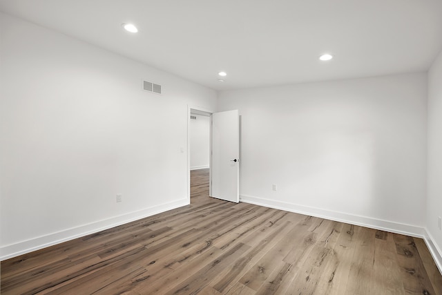 spare room featuring light hardwood / wood-style flooring