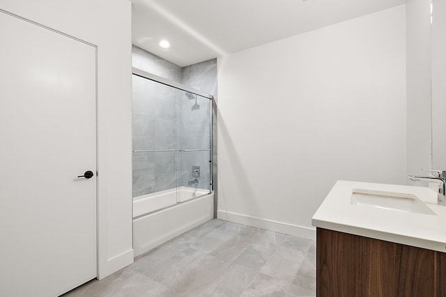 bathroom featuring vanity and enclosed tub / shower combo