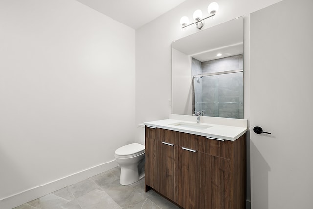 full bath featuring a shower stall, vanity, toilet, and baseboards