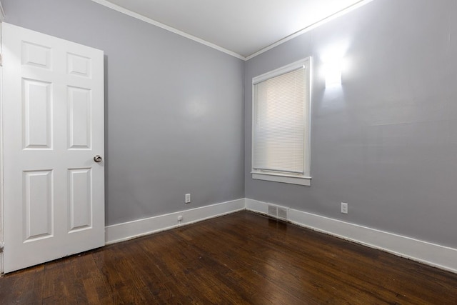 unfurnished room with hardwood / wood-style flooring and ornamental molding