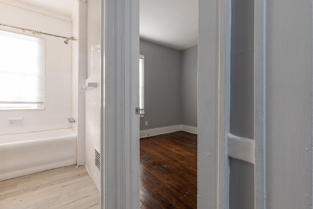 corridor featuring light hardwood / wood-style floors