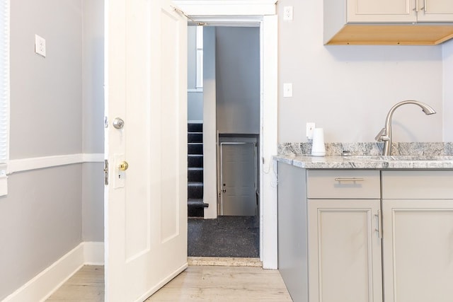 interior space featuring sink and light hardwood / wood-style floors