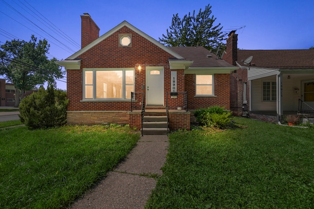 view of front of house with a yard