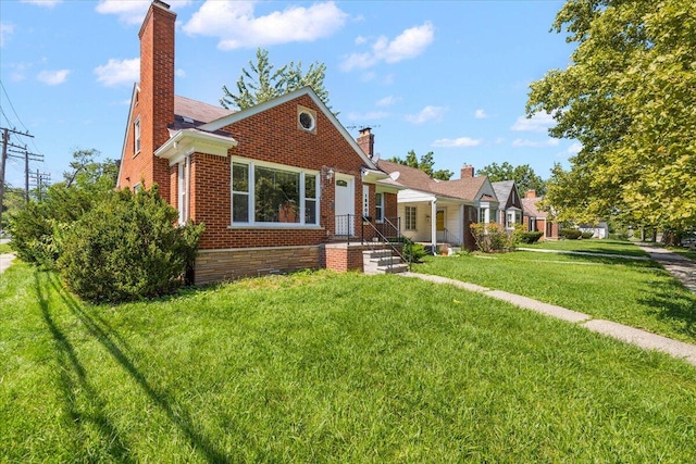 bungalow-style house with a front lawn