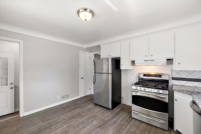 kitchen featuring white cabinets, dark hardwood / wood-style flooring, appliances with stainless steel finishes, and tasteful backsplash