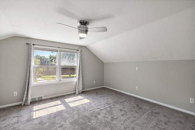 additional living space featuring carpet flooring, ceiling fan, and lofted ceiling