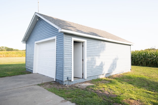 garage featuring a yard