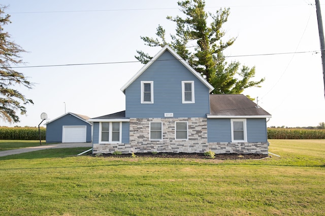 exterior space with a garage, a front lawn, and an outdoor structure